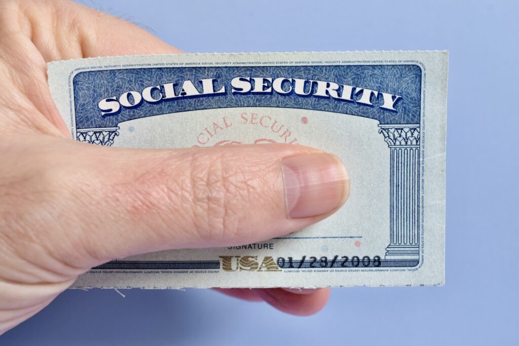 a man holding a social security card